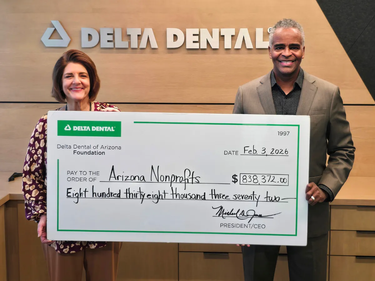 Delta Dental of Arizona Foundation executive director Barb Kozuh and Delta Dental of Arizona president and CEO Michael Jones presenting the 2026 grant recipient check. Courtesy of Delta Dental of Arizona