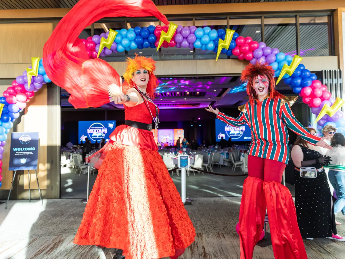 'Cyndi Lauper' and 'David Bowie' Stilt Walkers welcoming guests at Child Crisis Arizona's 49th Annual Fundraising Gala. Courtesy Child Crisis Arizona